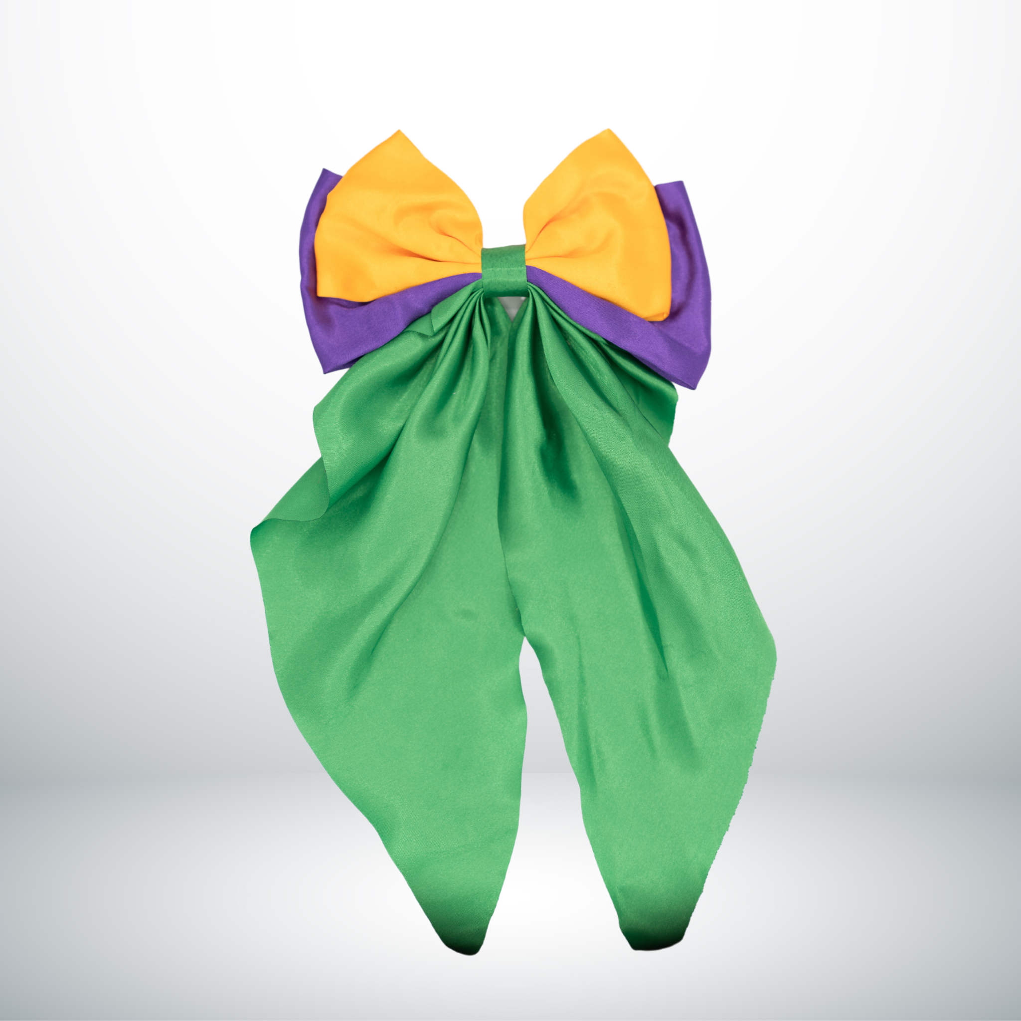 Mardi Gras Oversized Bow Hair Clip with purple, gold, and cascading green ribbons.