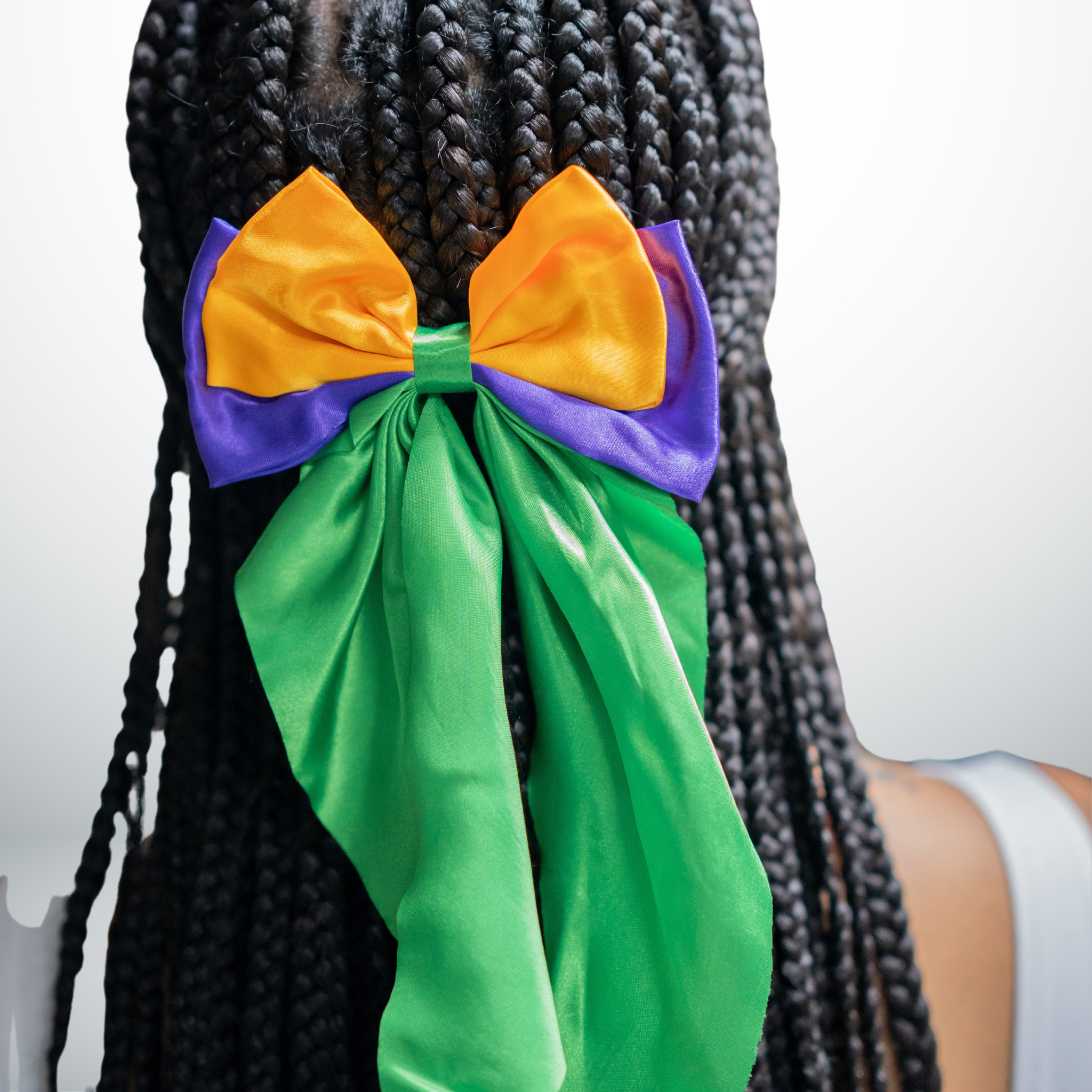Mardi Gras Oversized Bow Hair Clip with purple, gold, and cascading green ribbons.