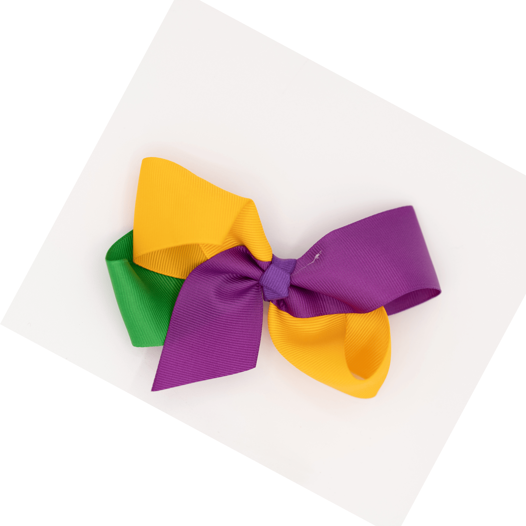 Mardi Gras Ribbon Bow Hair Clip with purple, green, and gold ribbon attached to a sturdy alligator clip, perfect for festive celebrations.