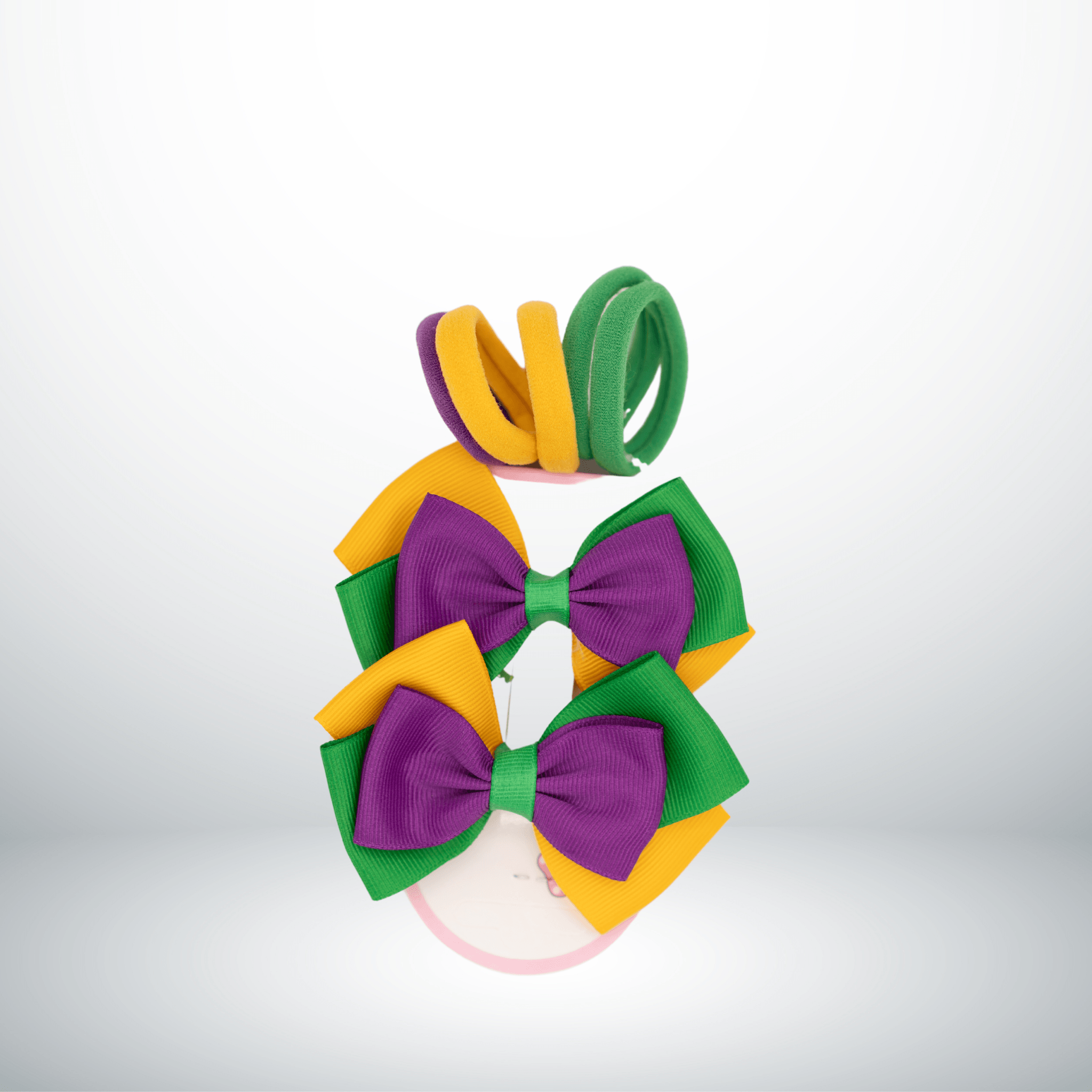 Mardi Gras Hair Bow and Elastic Set in purple, green, and gold with matching elastic hair ties, perfect for festive celebrations