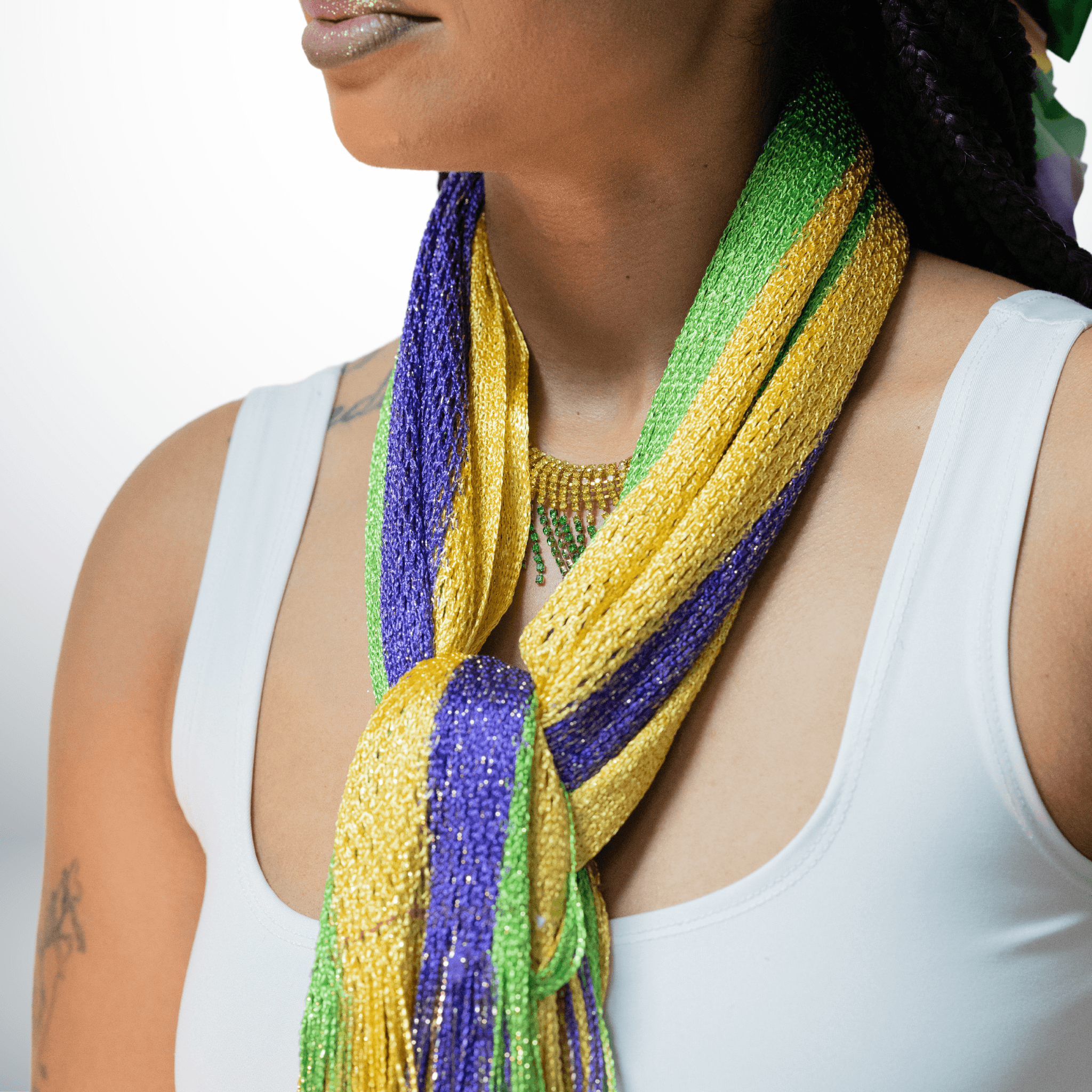 Mardi Gras Striped Scarf with fringe in purple, green, and gold, perfect for festive occasions and parades.